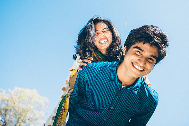 Playful Indian young couple Piggybacking